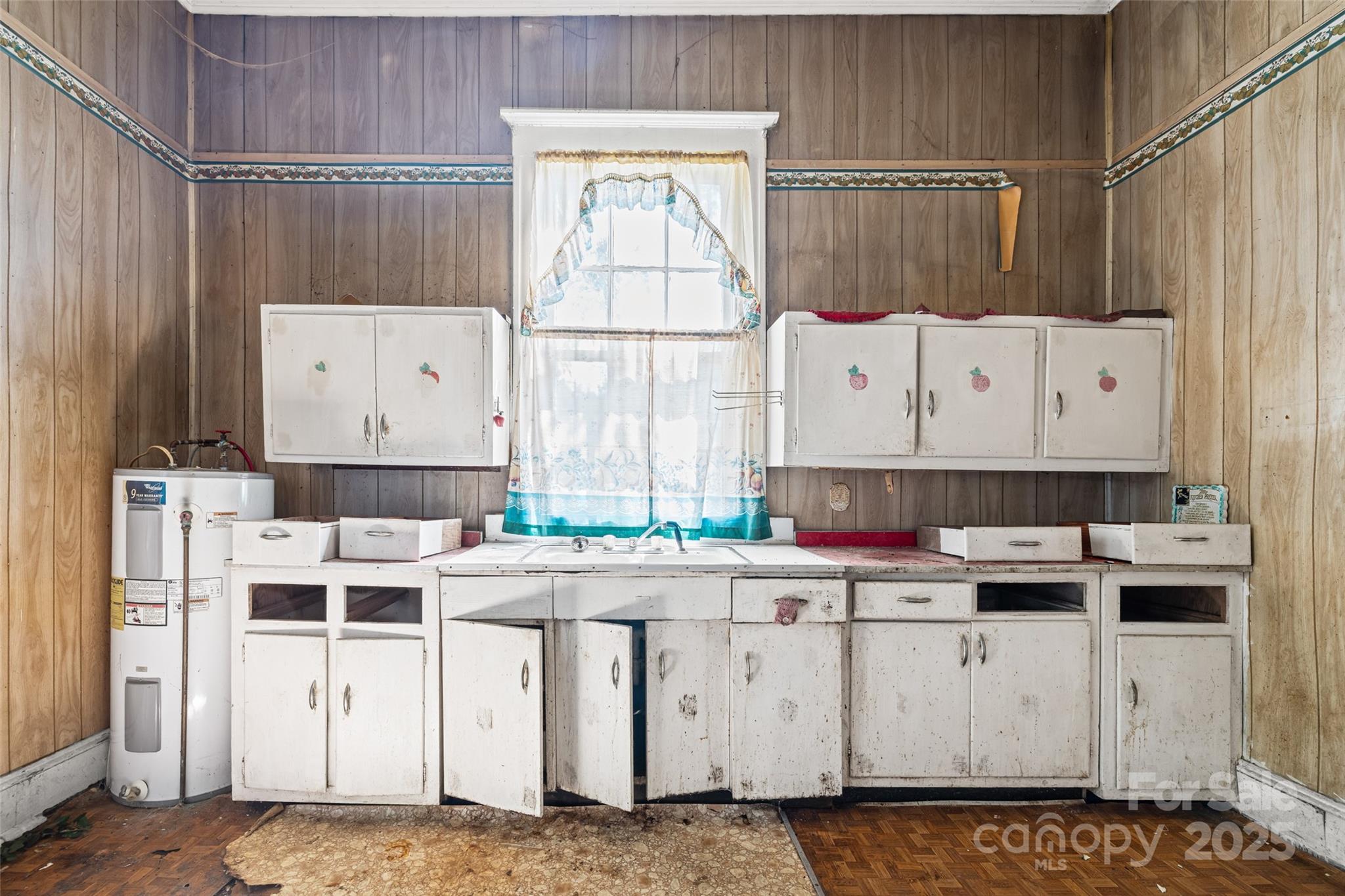108 Walker Street Chester, SC 29706 - Photo 18 of 31 a kitchen with a stove a refrigerator and a window