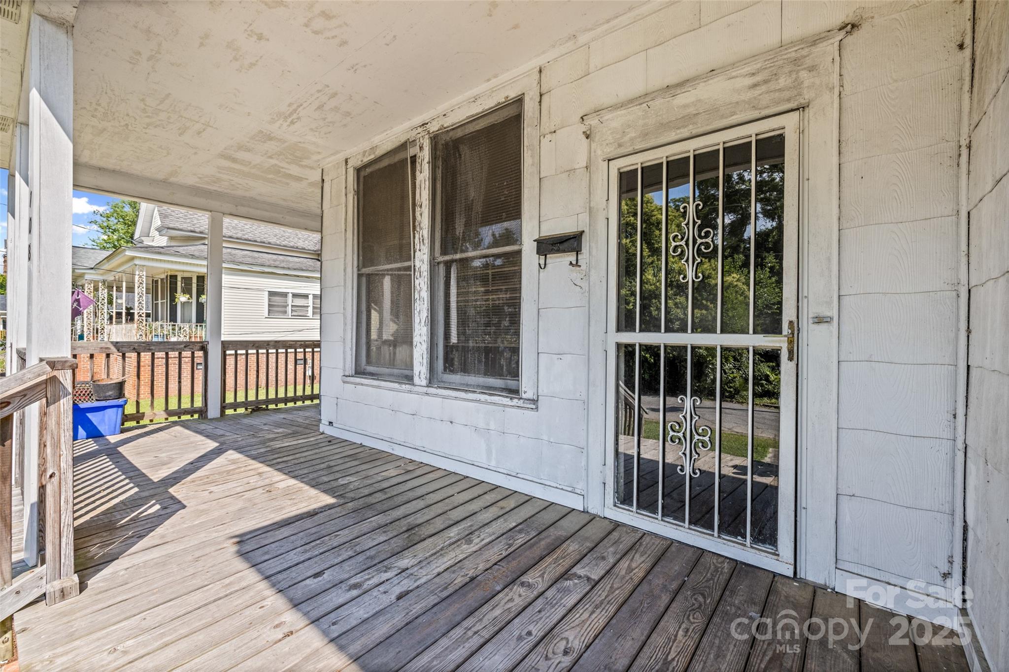 108 Walker Street Chester, SC 29706 - Photo 3 of 31 a porch with wooden floor and windows