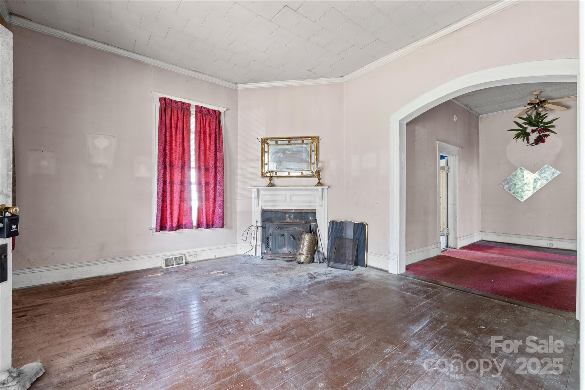 108 Walker Street Chester, SC 29706 - Photo 6 of 31 a view of a livingroom with an empty space and a fireplace