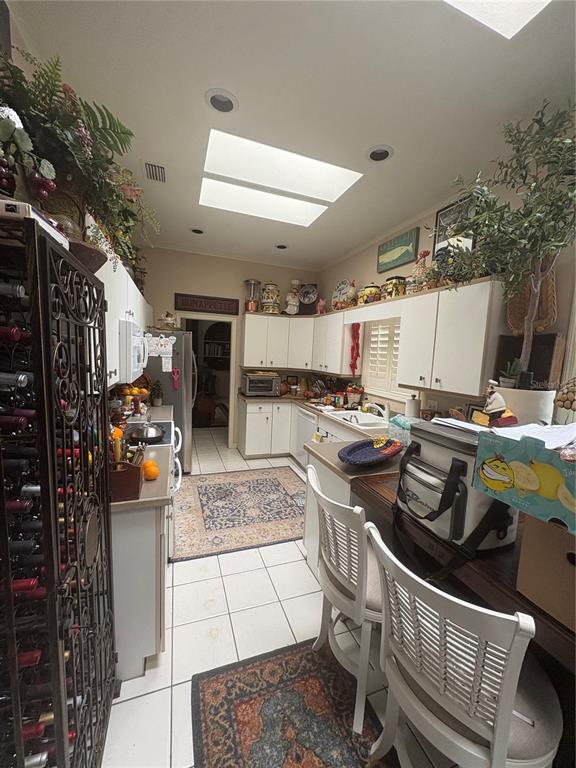 280 Springside Road Longwood, FL 32779 - Photo 24 of 29 a kitchen with stainless steel appliances granite countertop a stove and a refrigerator