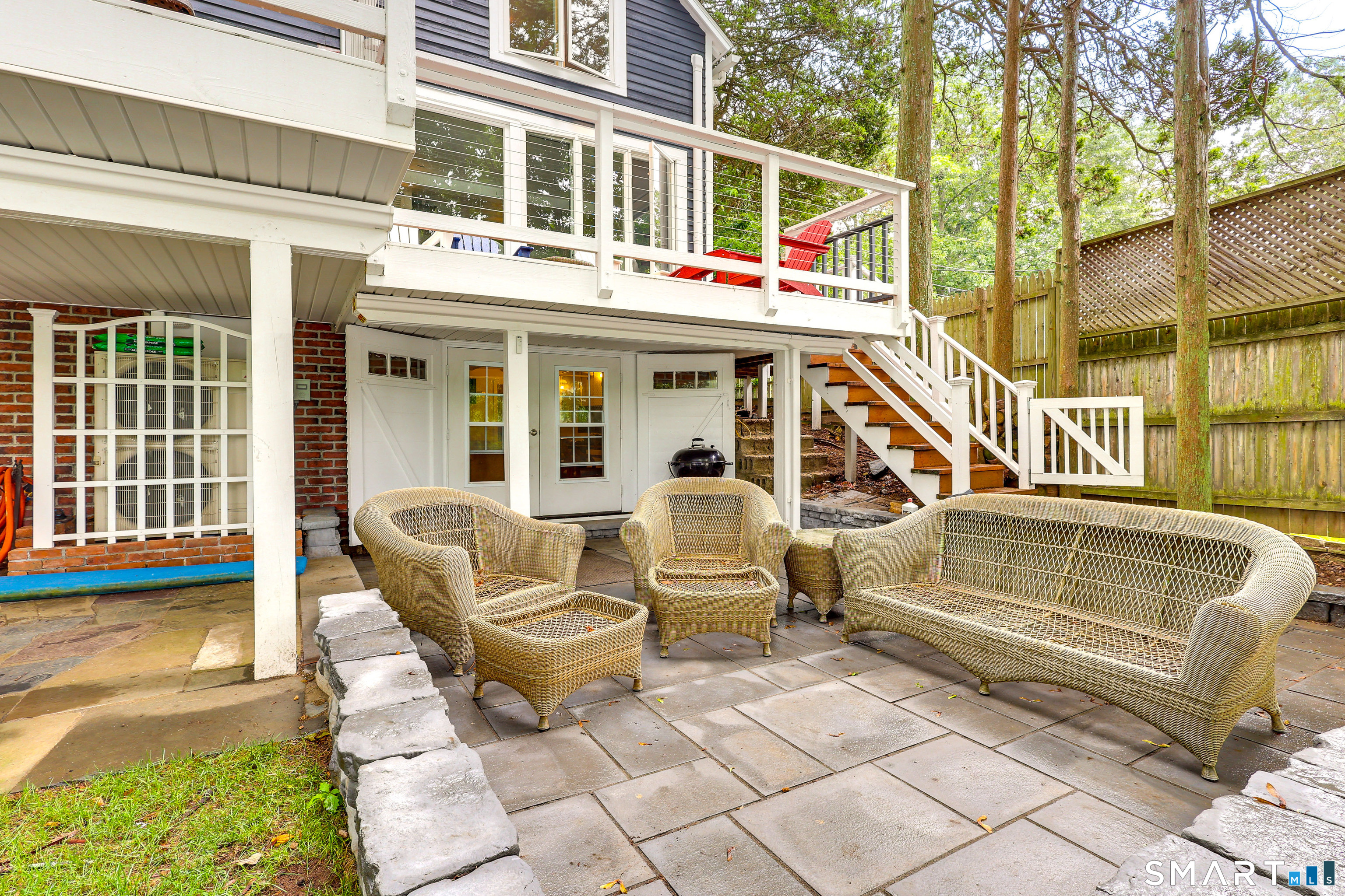 11 Stanton Street Waterford, CT 06385 - Photo 11 of 40 a view of a patio with couches table and chairs with wooden floor and fence