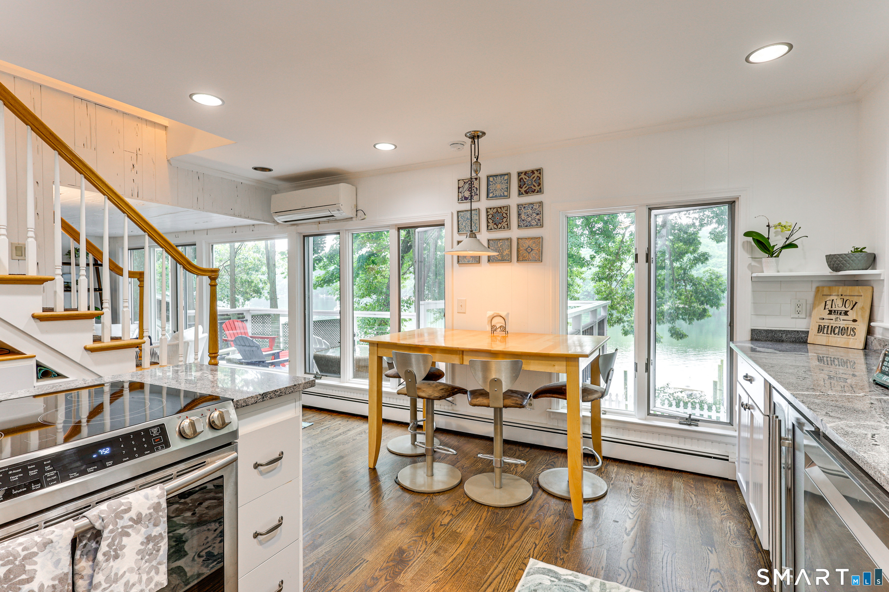 11 Stanton Street Waterford, CT 06385 - Photo 16 of 40 a kitchen with stainless steel appliances granite countertop a stove and a wooden floors