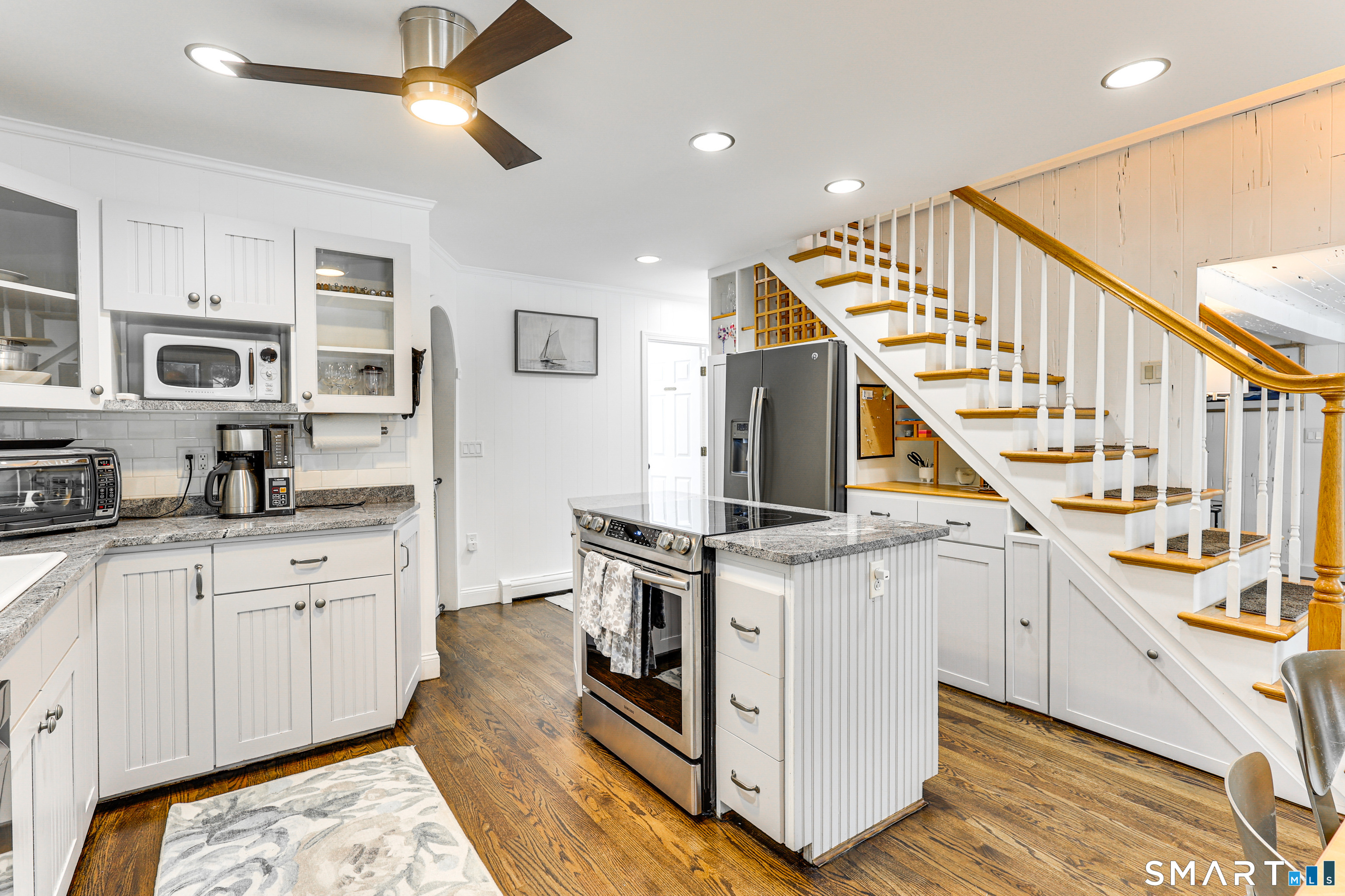 11 Stanton Street Waterford, CT 06385 - Photo 17 of 40 a open kitchen with stainless steel appliances granite countertop a stove and a sink
