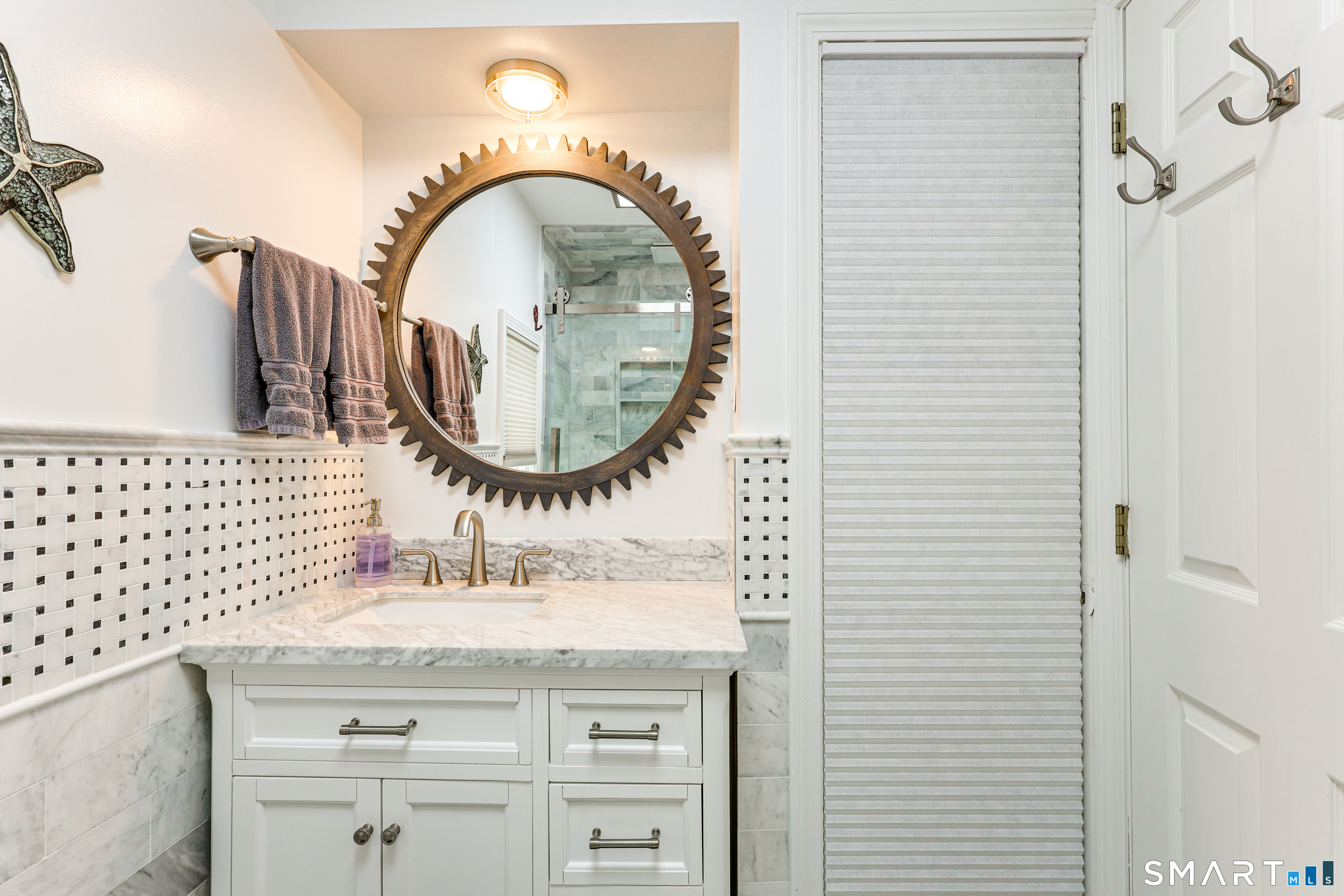 11 Stanton Street Waterford, CT 06385 - Photo 22 of 40 a bathroom with a sink and a mirror