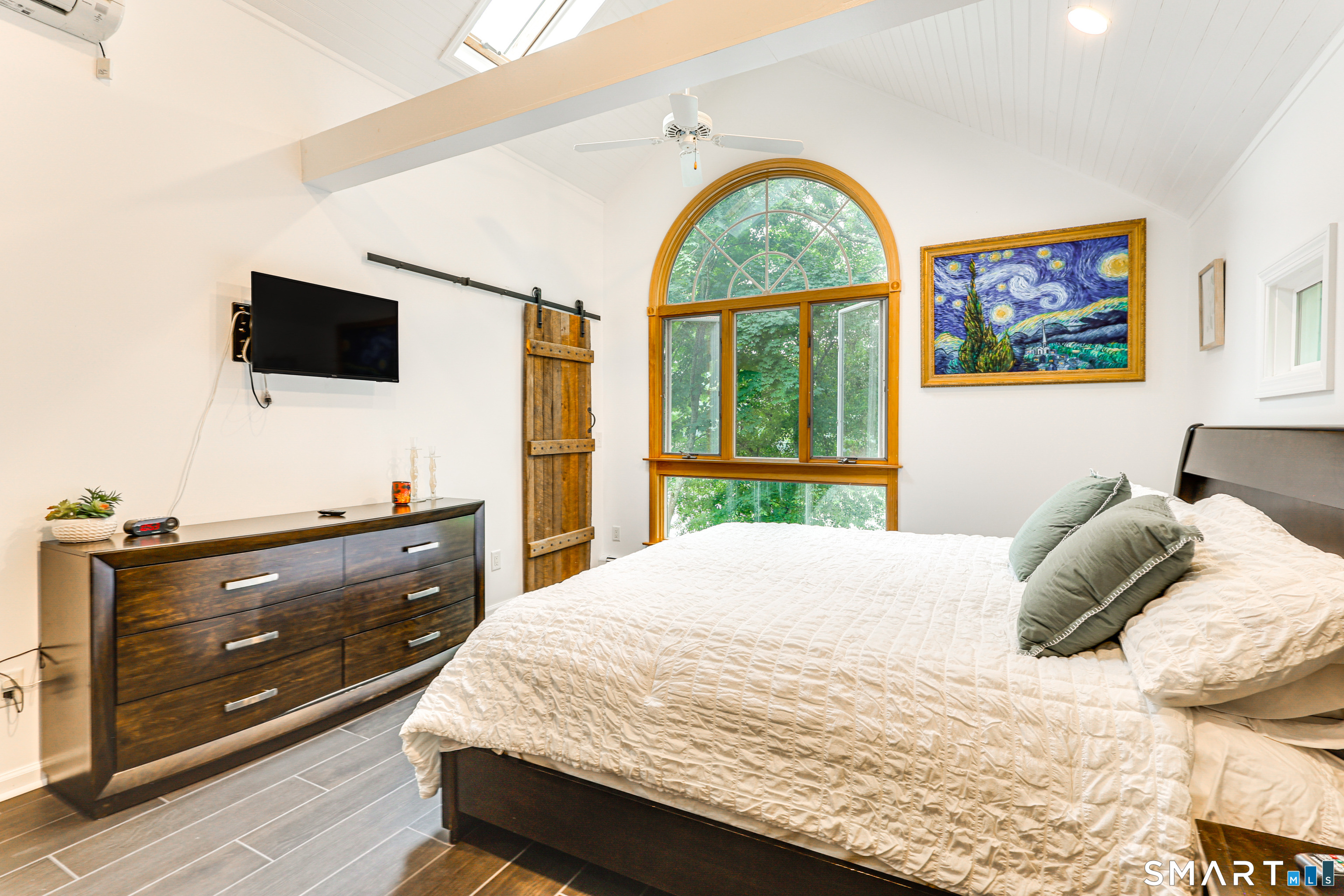 11 Stanton Street Waterford, CT 06385 - Photo 24 of 40 a bedroom with a bed and a flat screen tv