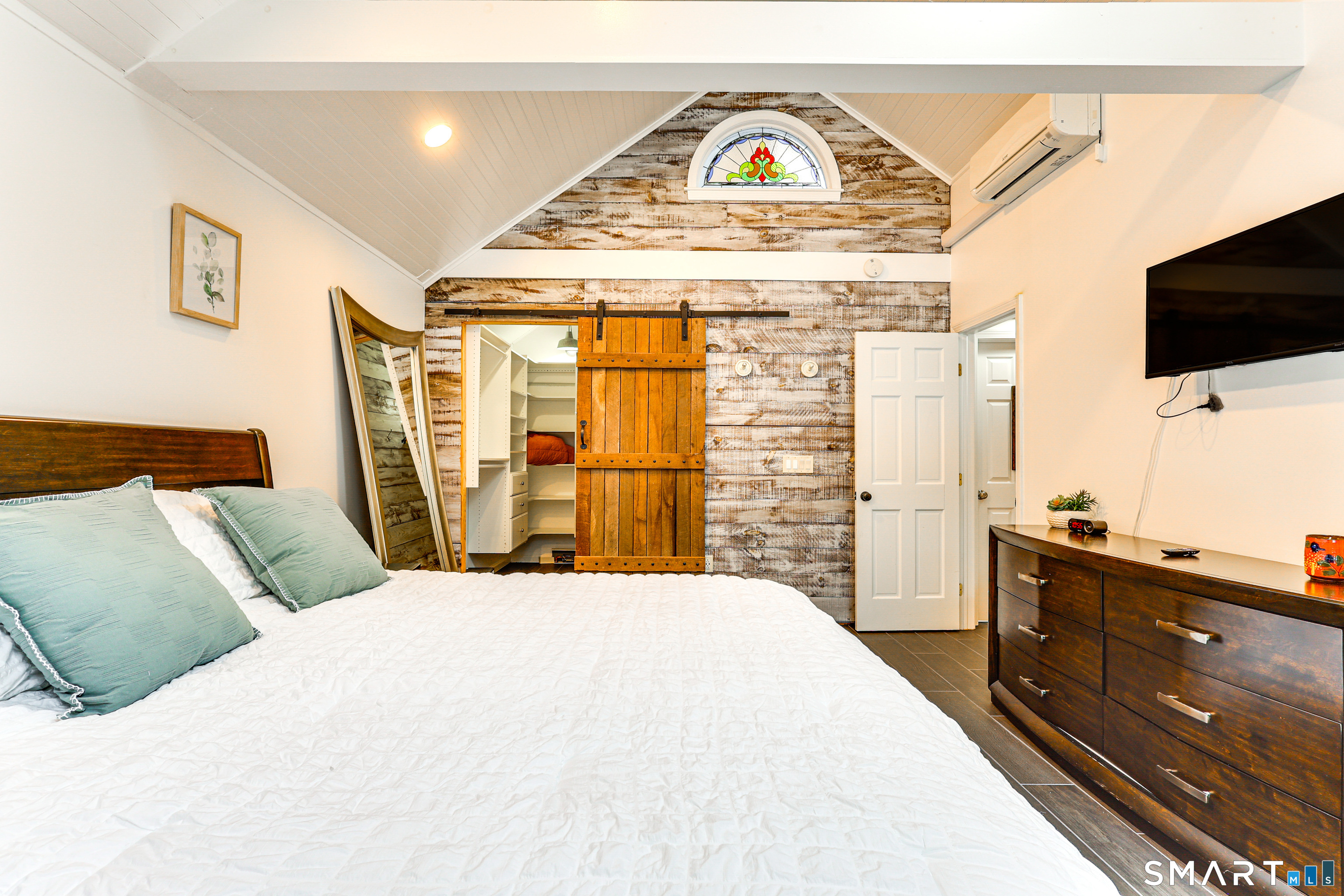 11 Stanton Street Waterford, CT 06385 - Photo 25 of 40 a bedroom with a bed and a flat screen tv