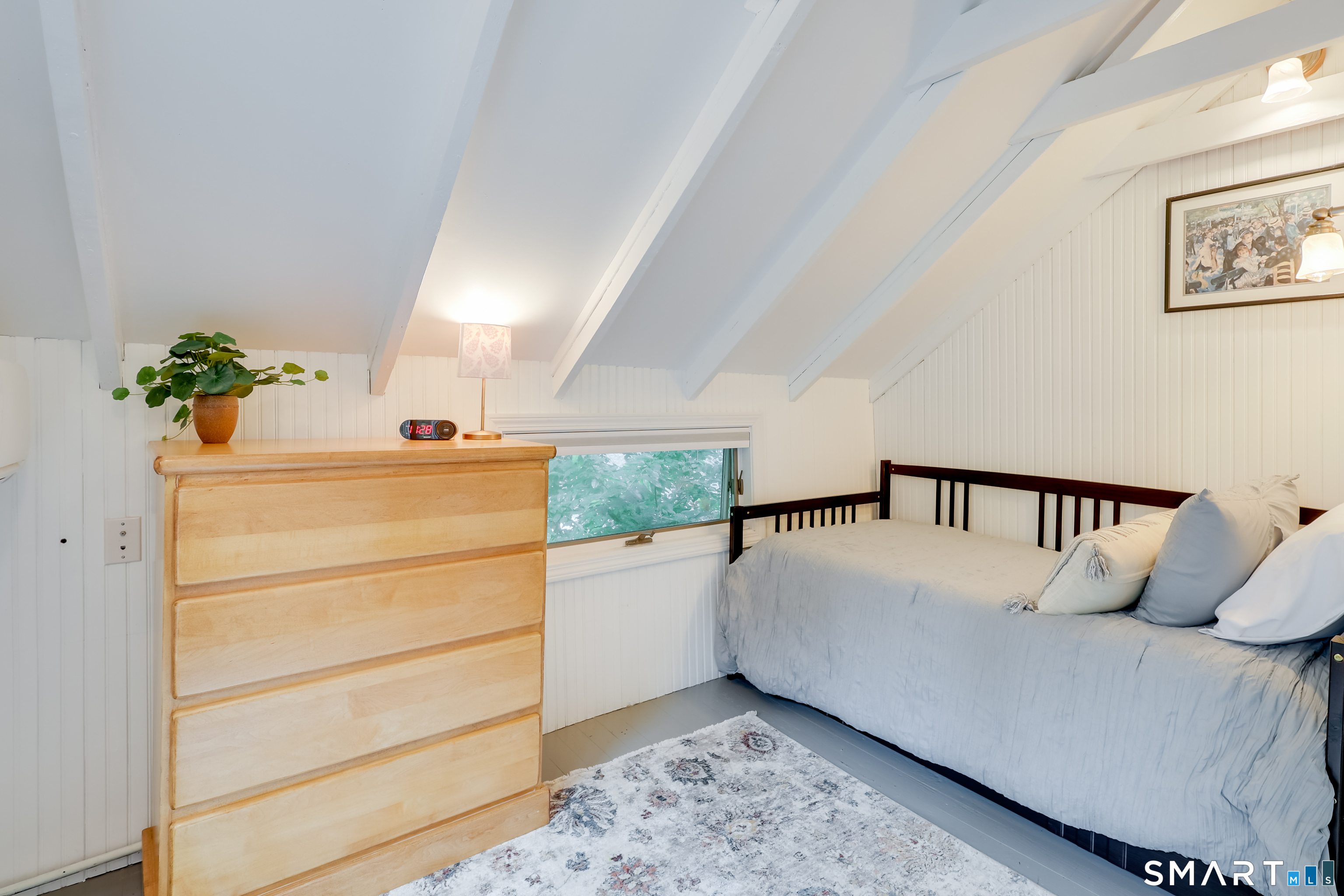 11 Stanton Street Waterford, CT 06385 - Photo 31 of 40 a room with a bed and a potted plant