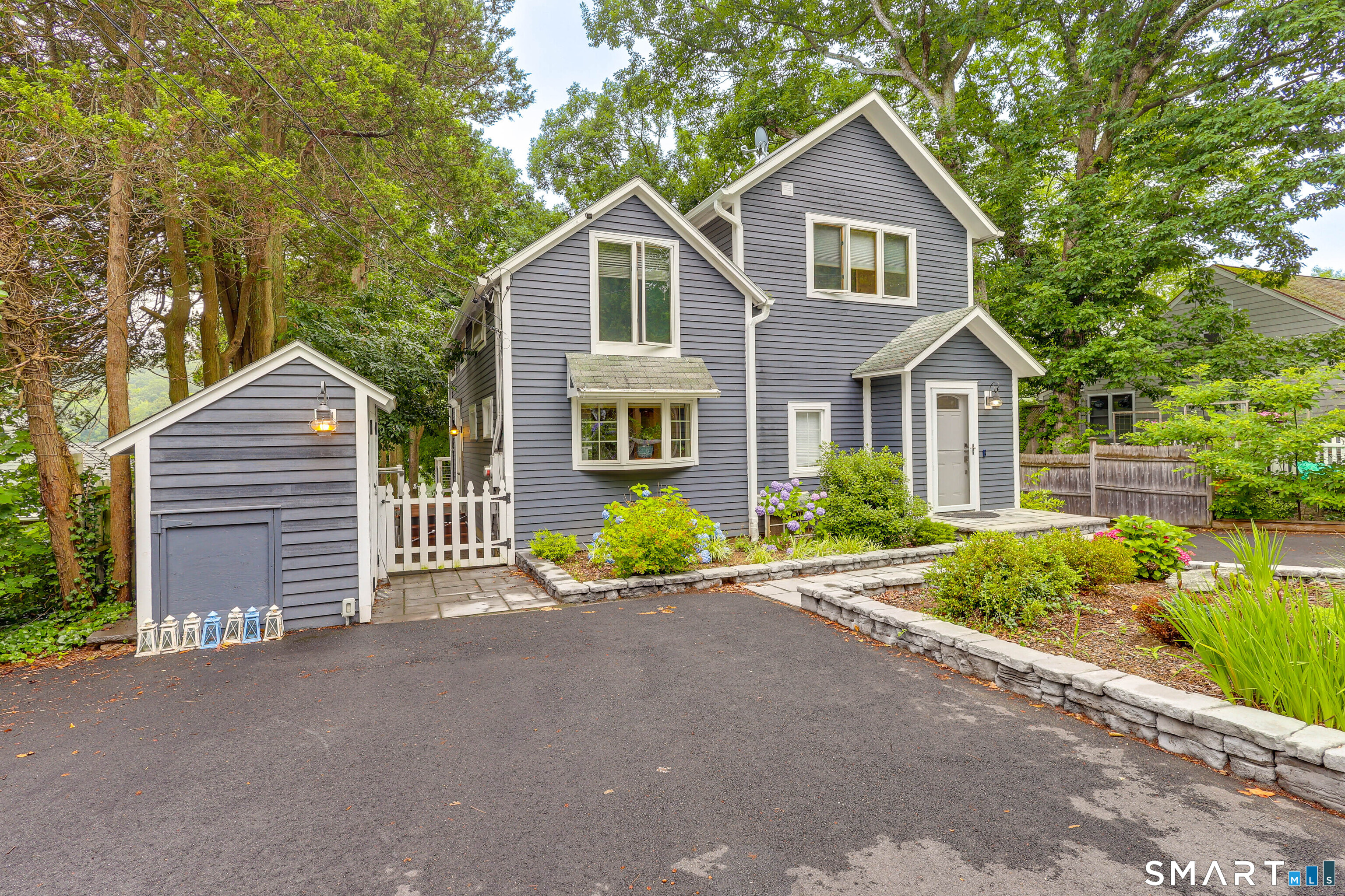 11 Stanton Street Waterford, CT 06385 - Photo 5 of 40 a front view of a house with a yard and garage