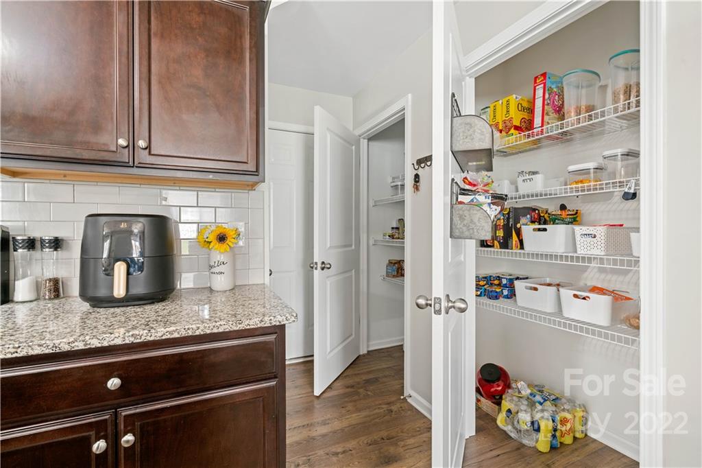 614 Shellbark Drive Concord, NC 28025 - Photo 13 of 30 a kitchen with stainless steel appliances granite countertop a refrigerator and a sink