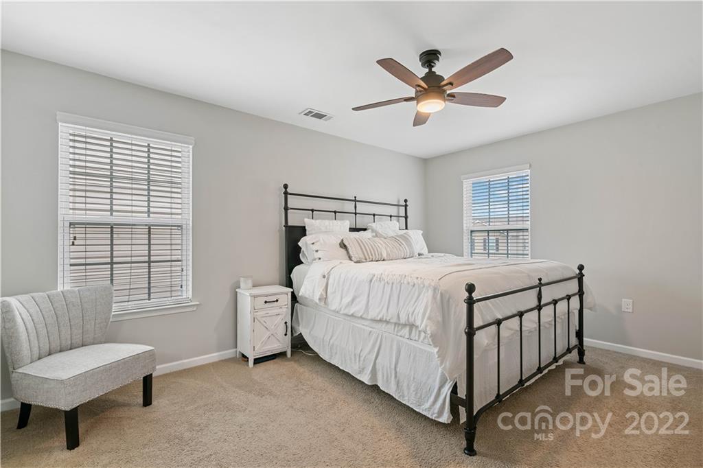 614 Shellbark Drive Concord, NC 28025 - Photo 15 of 30 a bedroom with a bed and window