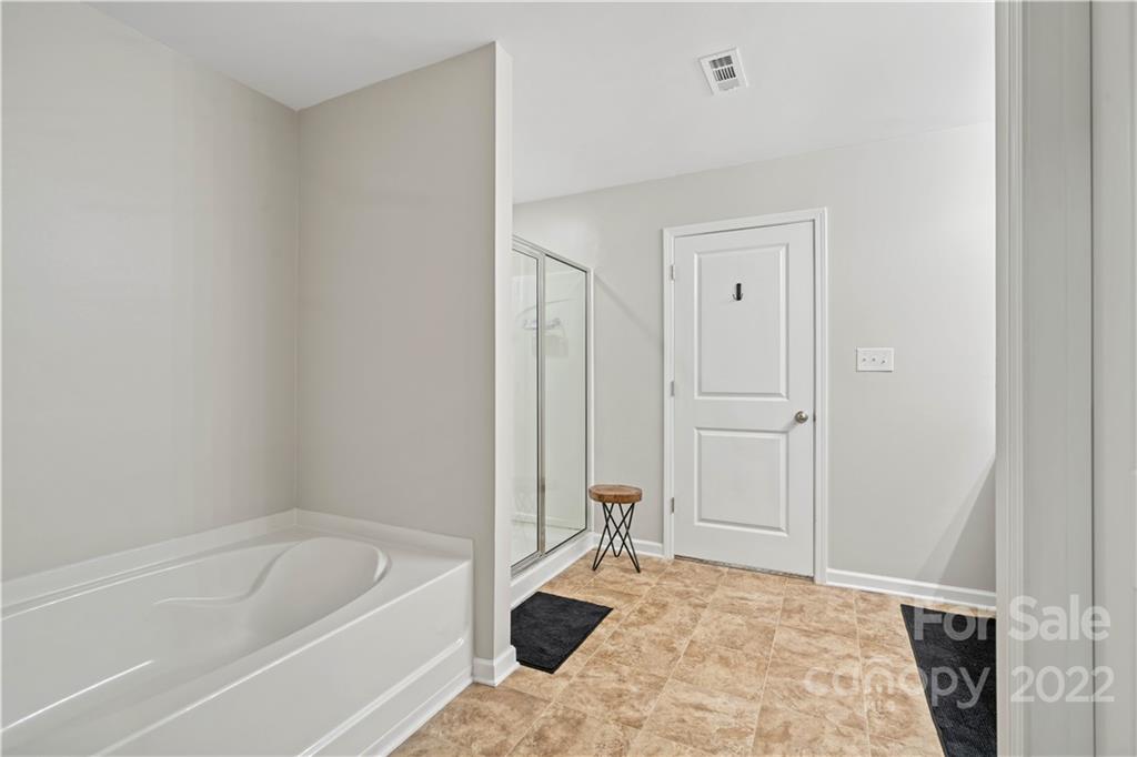 614 Shellbark Drive Concord, NC 28025 - Photo 20 of 30 a bathroom with a tub and a sink