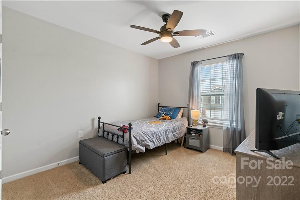 614 Shellbark Drive Concord, NC 28025 - Photo 21 of 30 a living room with furniture and a flat screen tv