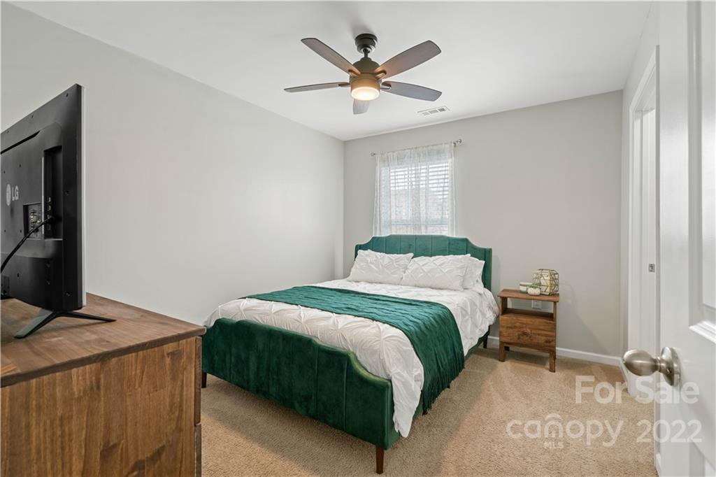614 Shellbark Drive Concord, NC 28025 - Photo 23 of 30 a bedroom with a bed and window