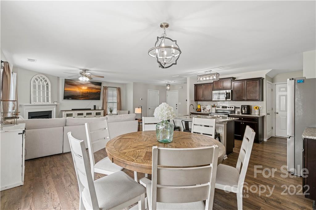 614 Shellbark Drive Concord, NC 28025 - Photo 5 of 30 a dining room with furniture and kitchen view