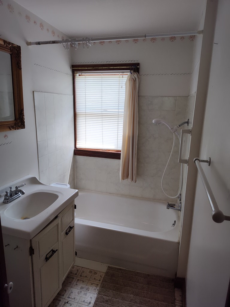 730 Main Street Polk, PA 16342 - Photo 12 of 43 a bathroom with a tub sink and a mirror