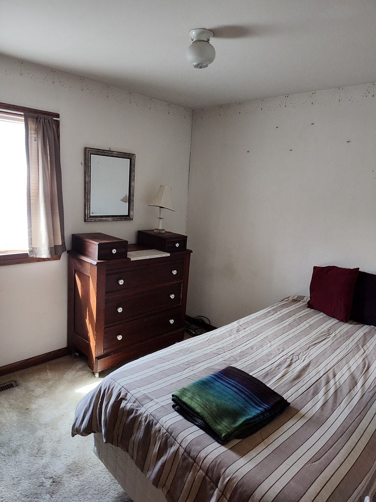 730 Main Street Polk, PA 16342 - Photo 15 of 43 a bedroom with a bed and a window