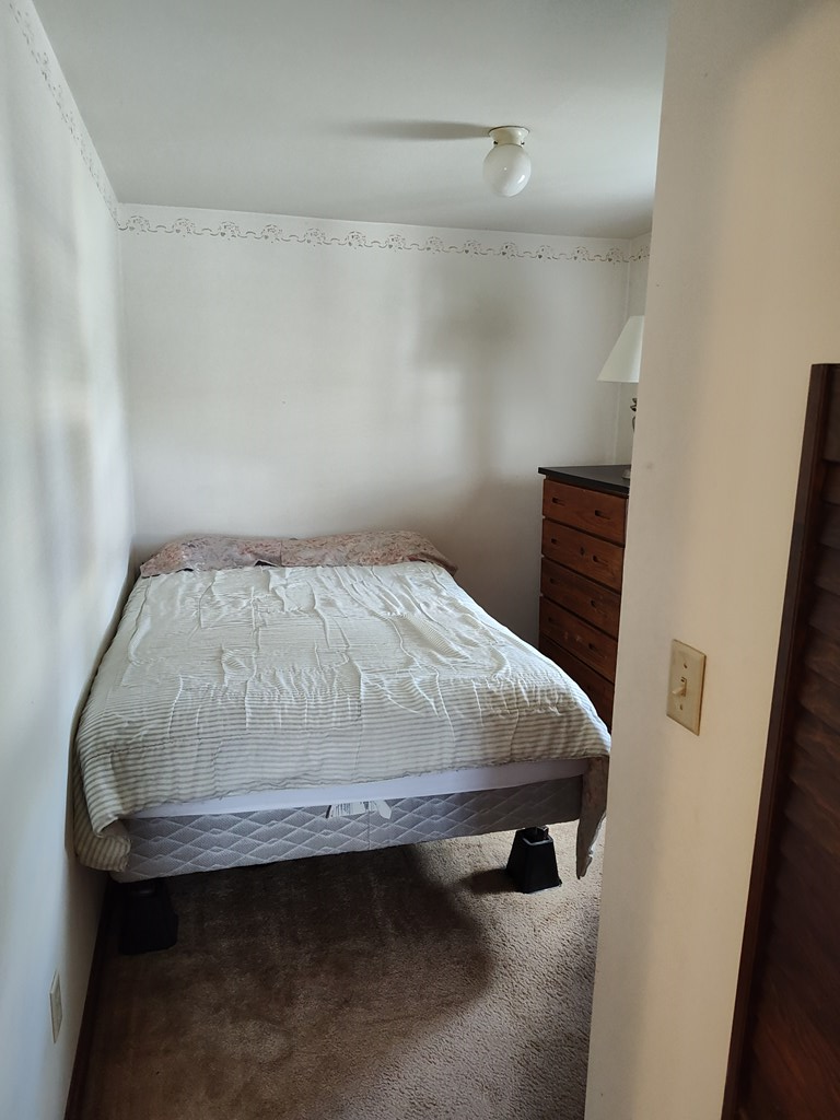 730 Main Street Polk, PA 16342 - Photo 23 of 43 a bedroom with a bed and a table