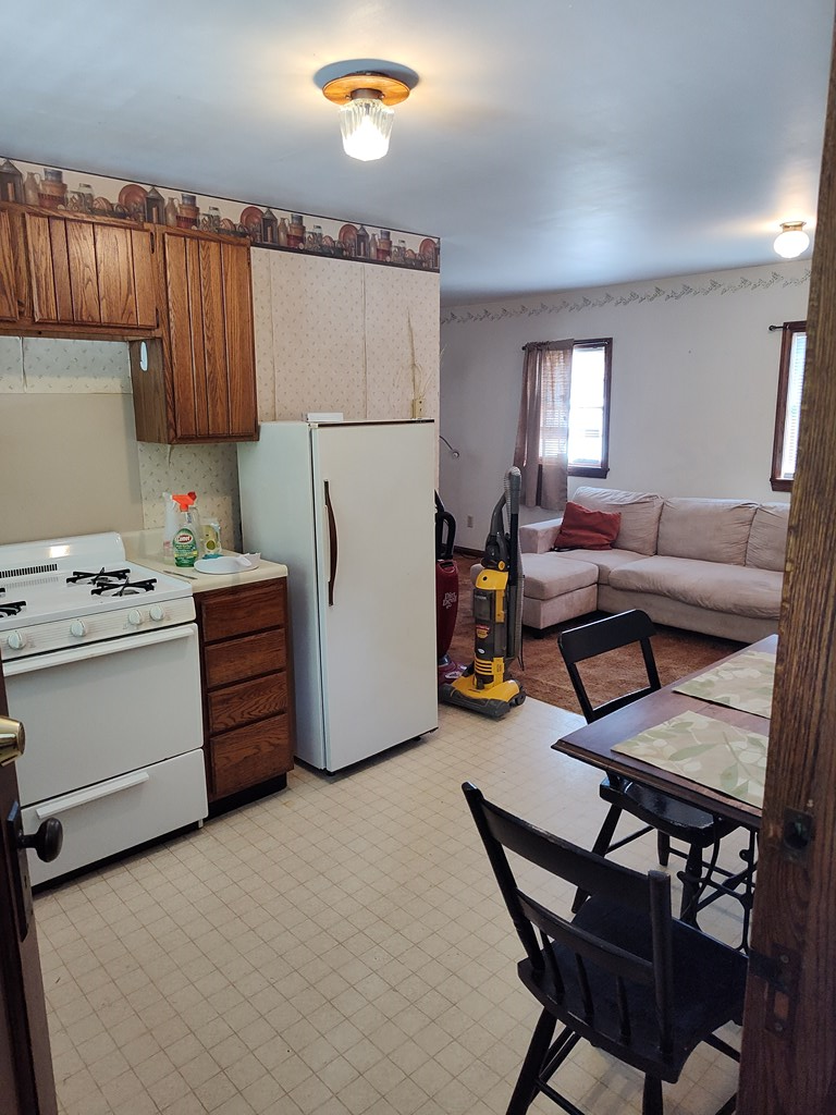 730 Main Street Polk, PA 16342 - Photo 26 of 43 a utility room with stainless steel appliances kitchen island granite countertop furniture and a refrigerator