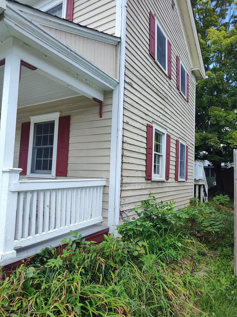 730 Main Street Polk, PA 16342 - Photo 30 of 43 a front view of a house with garden