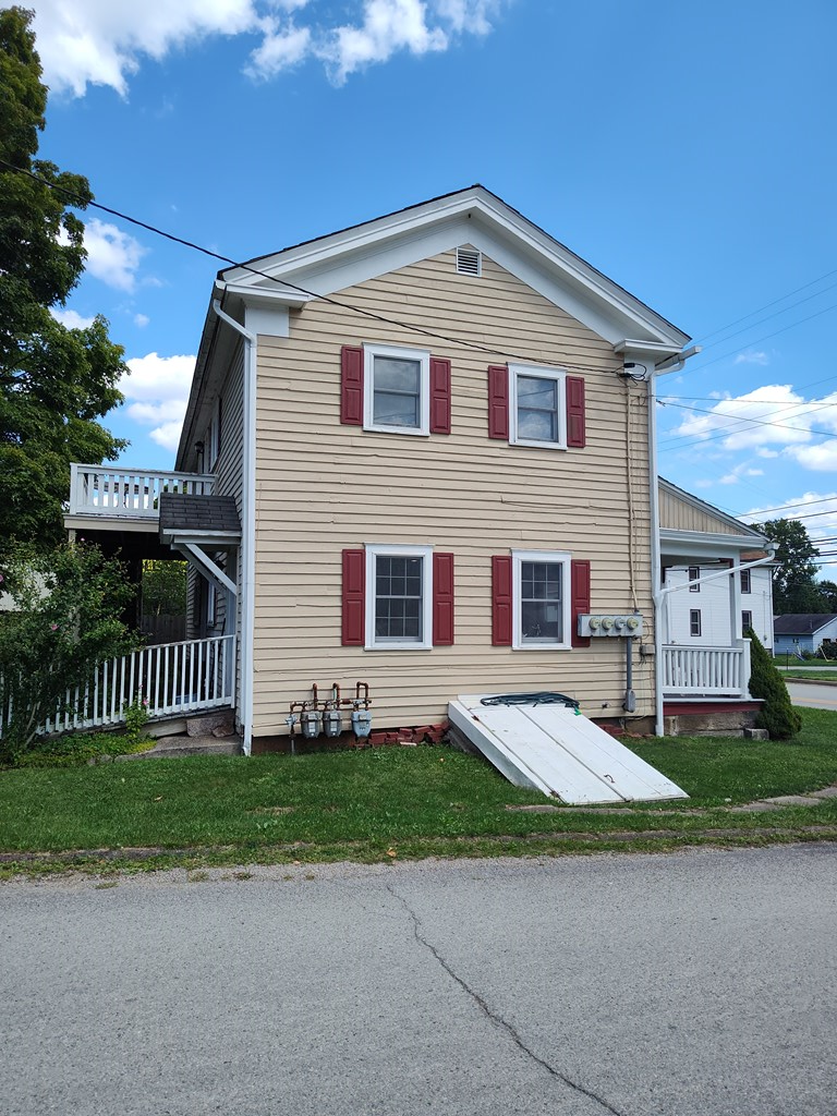 730 Main Street Polk, PA 16342 - Photo 33 of 43 a front view of a house with a yard