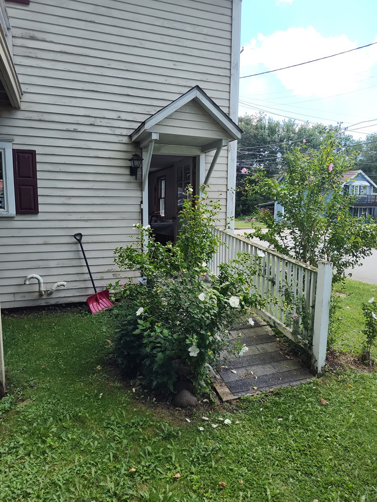730 Main Street Polk, PA 16342 - Photo 34 of 43 a front view of a house with a yard