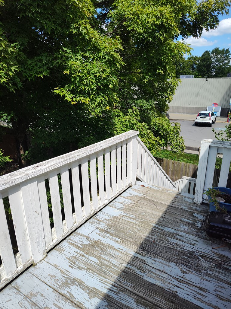 730 Main Street Polk, PA 16342 - Photo 10 of 43 a view of a wooden deck and a yard with swimming pool