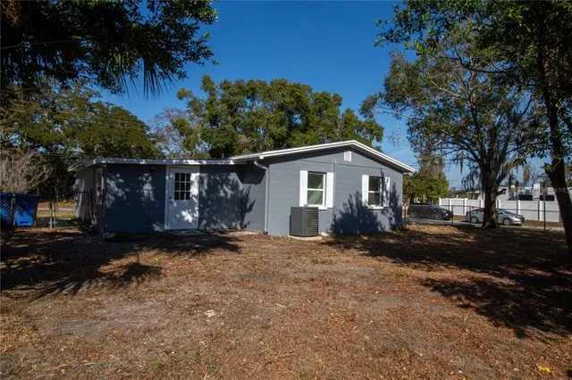 a backyard of a house with shaded area