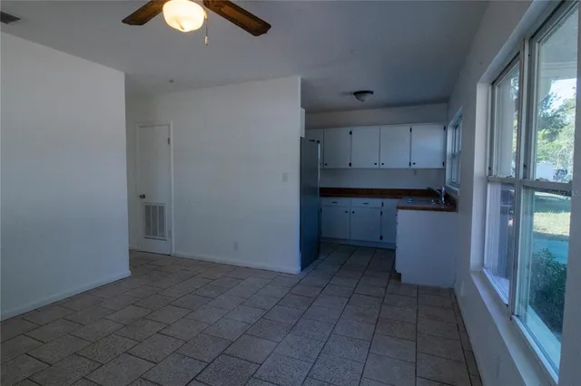 a view of cabinets and window in a room