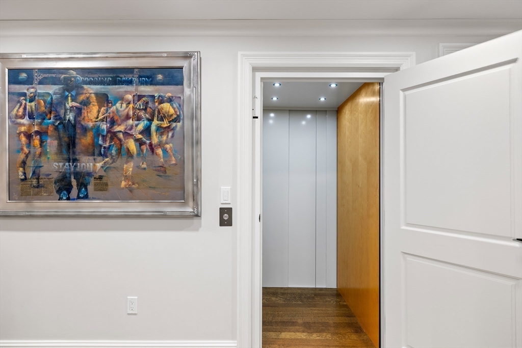 37 Radcliff Road Newton, MA 02468 - Photo 29 of 40 a view of a hallway with wooden shelves