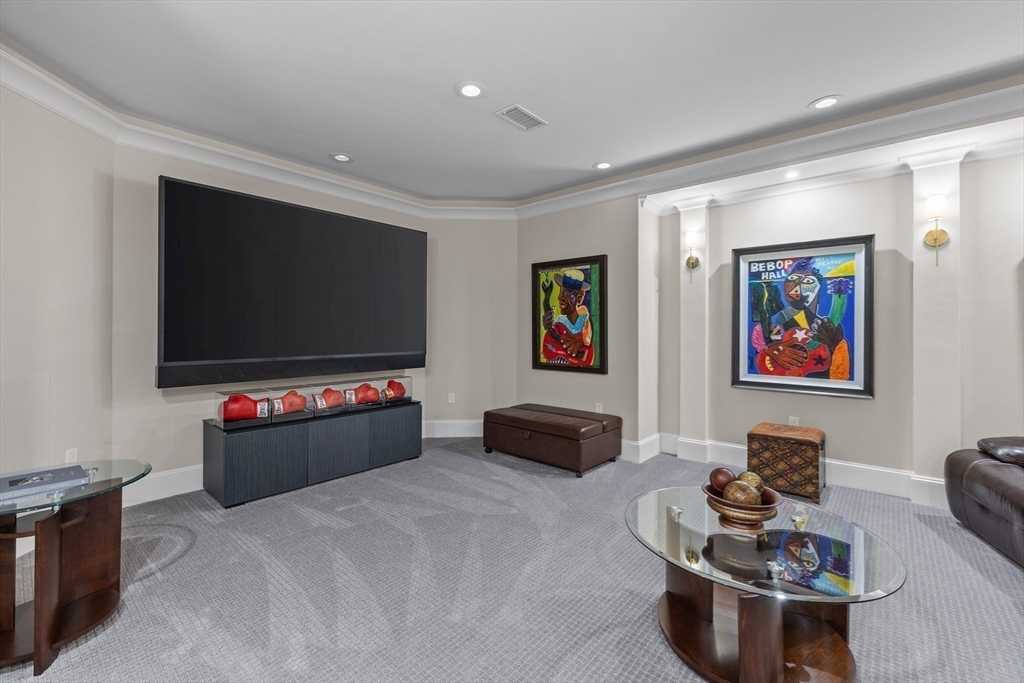 37 Radcliff Road Newton, MA 02468 - Photo 32 of 40 a living room with furniture and a flat screen tv