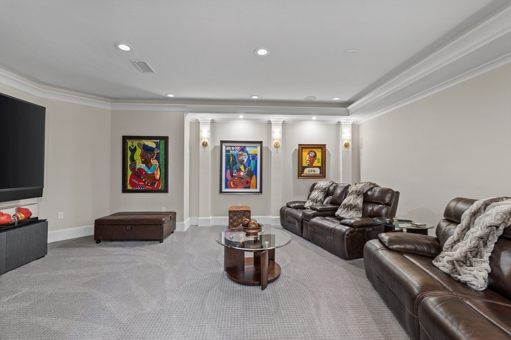 37 Radcliff Road Newton, MA 02468 - Photo 33 of 40 a living room with furniture and a flat screen tv