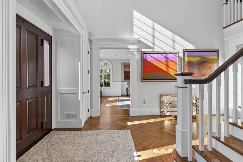 37 Radcliff Road Newton, MA 02468 - Photo 5 of 40 a living room with furniture a flat screen tv and floor to ceiling window
