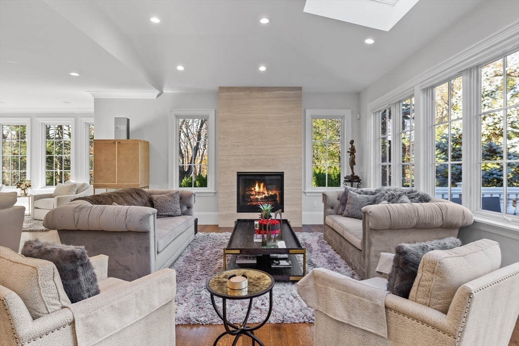 37 Radcliff Road Newton, MA 02468 - Photo 10 of 40 a living room with furniture fireplace and a large window