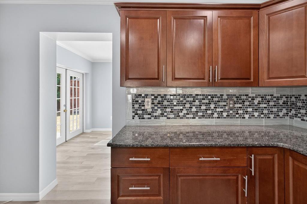 5352 Tangerine Drive New Port Richey, FL 34652 - Photo 19 of 76 a view of wooden cabinets
