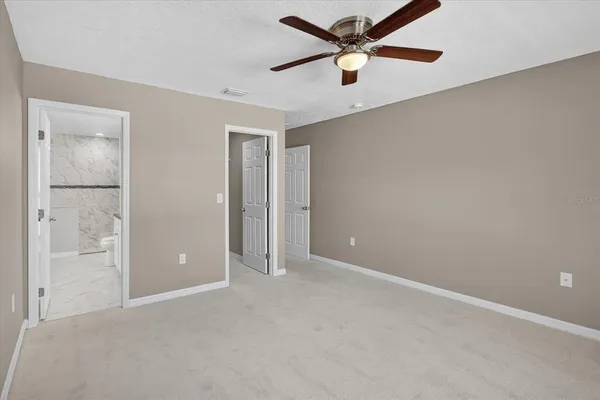 a room with a door and wooden floor