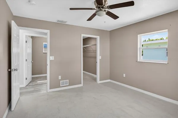 a view of an empty room with a window