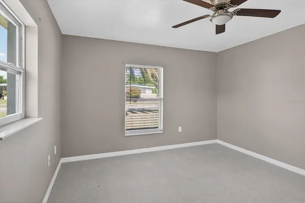 a view of an empty room with a window