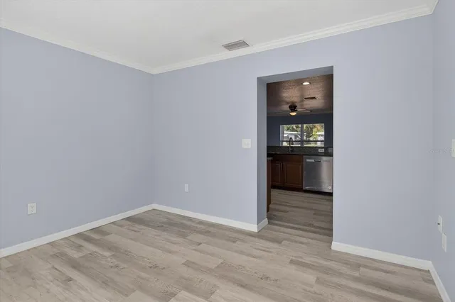 an aerial view of a house with swimming pool and furniture