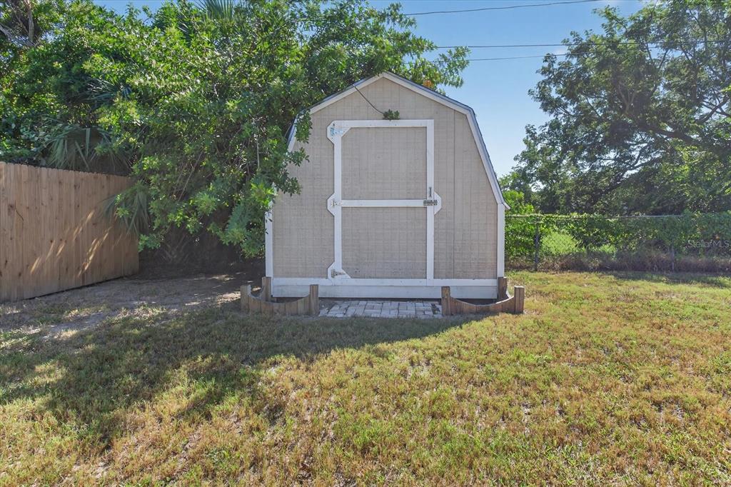 5352 Tangerine Drive New Port Richey, FL 34652 - Photo 52 of 76 a view of a house with a yard and large tree