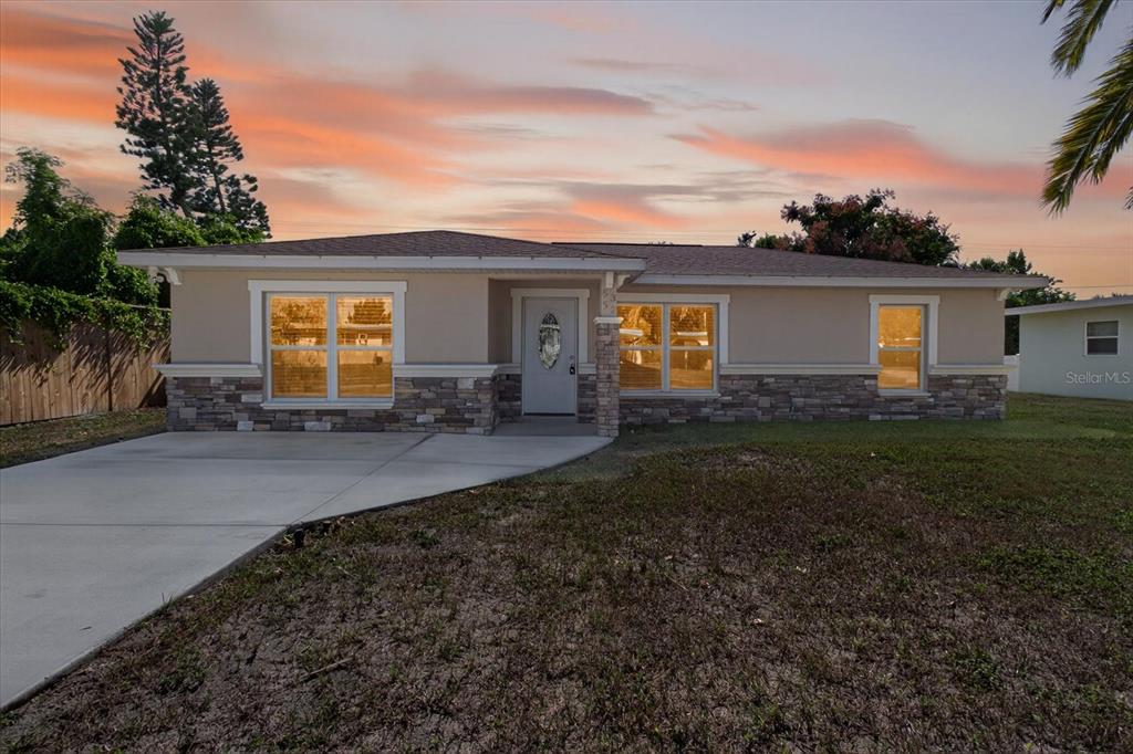 5352 Tangerine Drive New Port Richey, FL 34652 - Photo 6 of 76 a backyard of a house with yard fire pit and outdoor seating