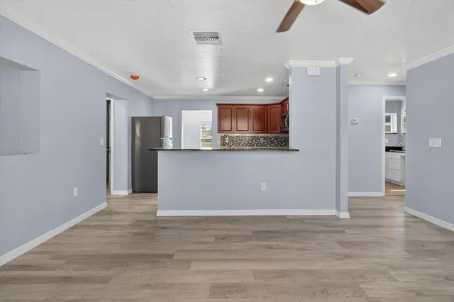 a kitchen with granite countertop a sink and a cabinets