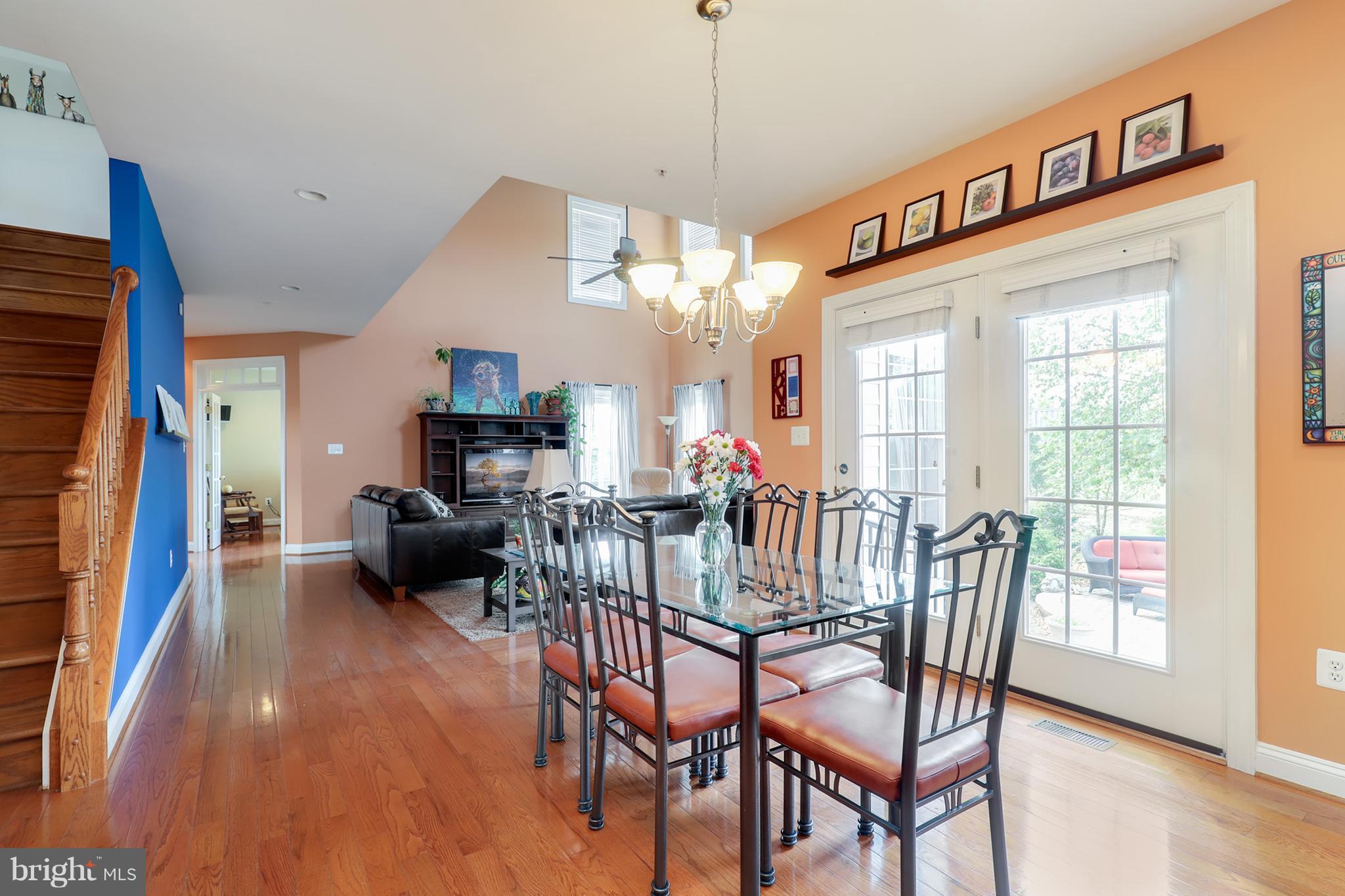 6905 Ironbridge Lane Laurel, MD 20707 - Photo 11 of 30 a view of a dining room with furniture window and wooden floor