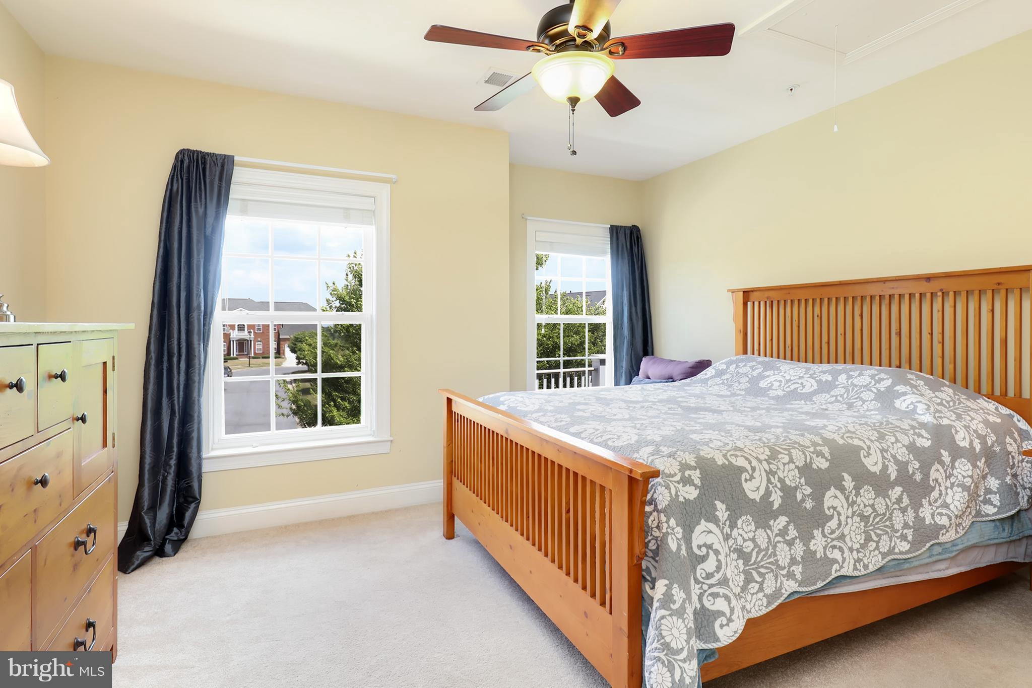 6905 Ironbridge Lane Laurel, MD 20707 - Photo 16 of 30 a bed sitting in a bedroom next to a window