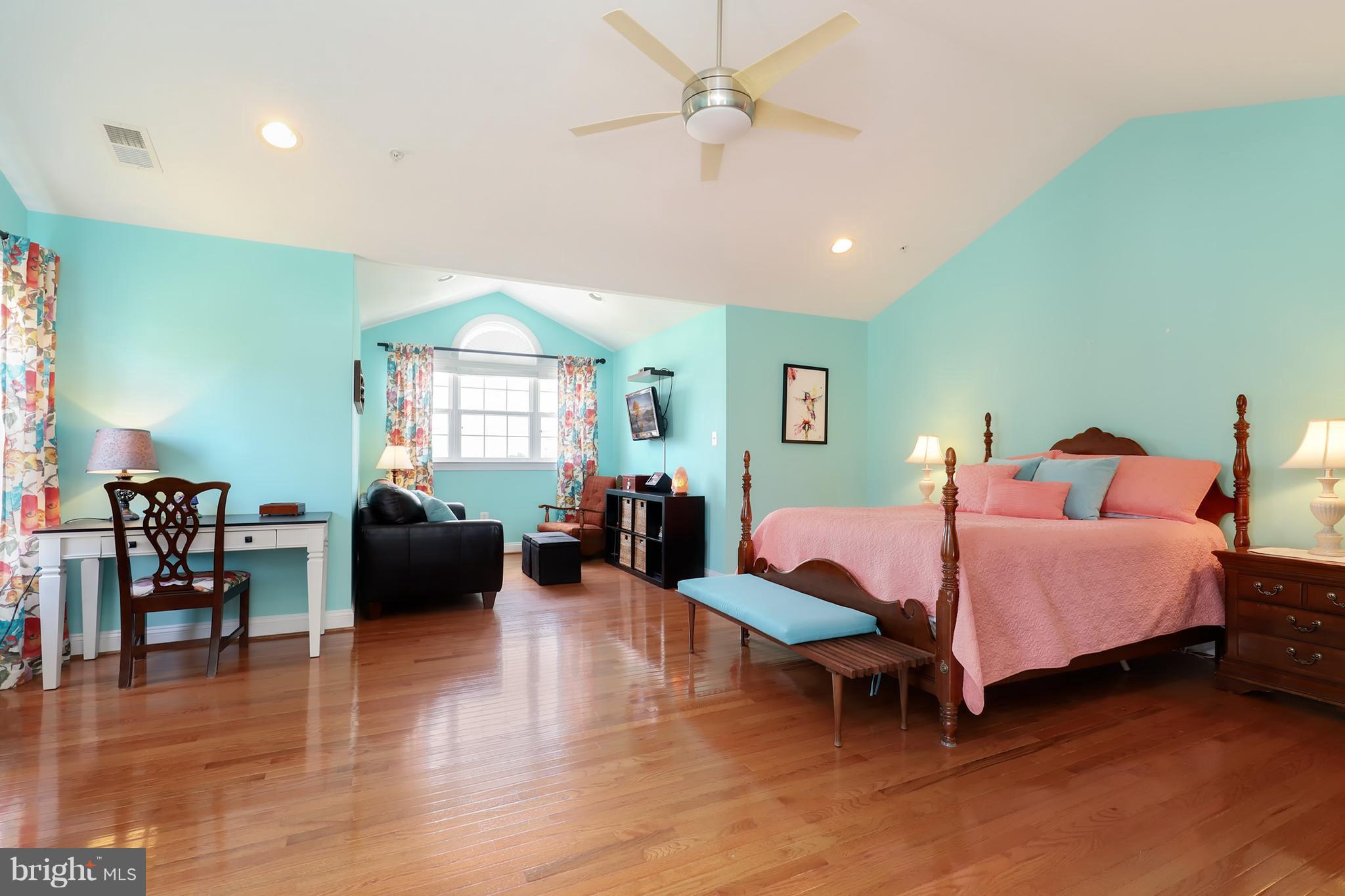 6905 Ironbridge Lane Laurel, MD 20707 - Photo 18 of 30 a spacious bedroom with furniture and a wooden floor