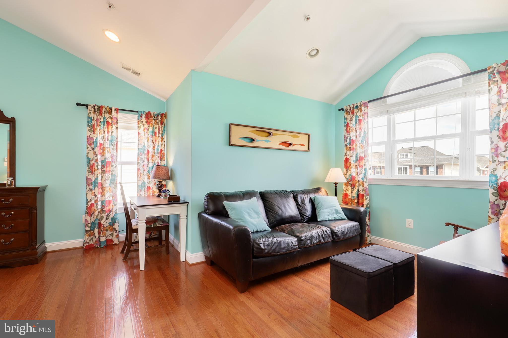 6905 Ironbridge Lane Laurel, MD 20707 - Photo 19 of 30 a living room with furniture and a wooden floor
