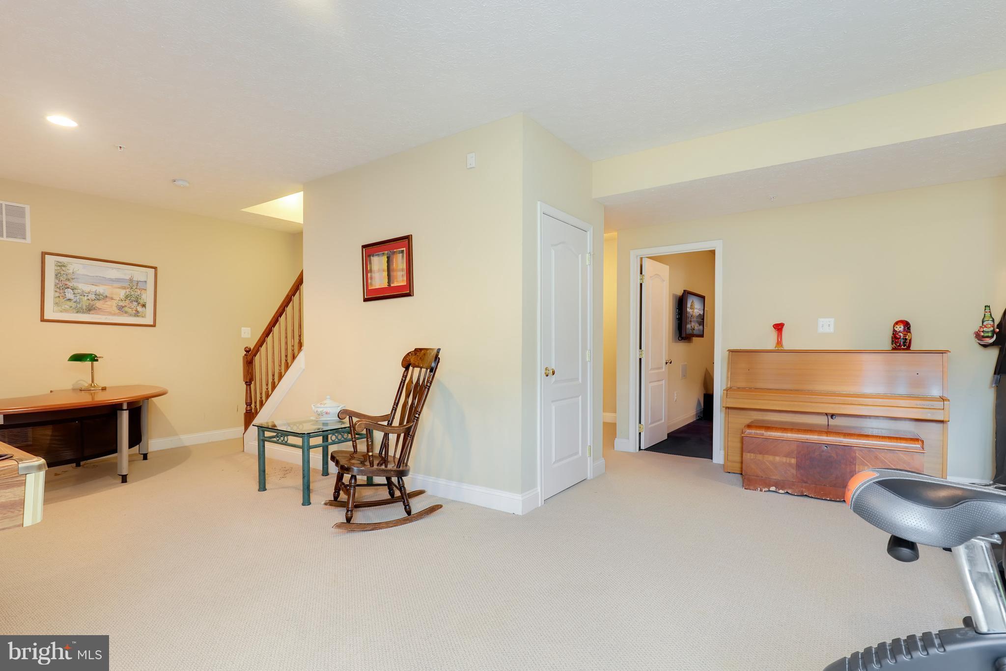 6905 Ironbridge Lane Laurel, MD 20707 - Photo 24 of 30 a room with furniture and a chair