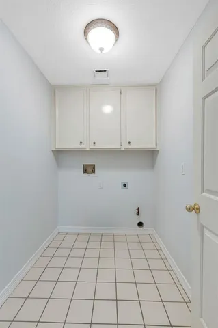 a view of an empty room and cabinets
