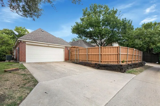 a view of backyard and garage