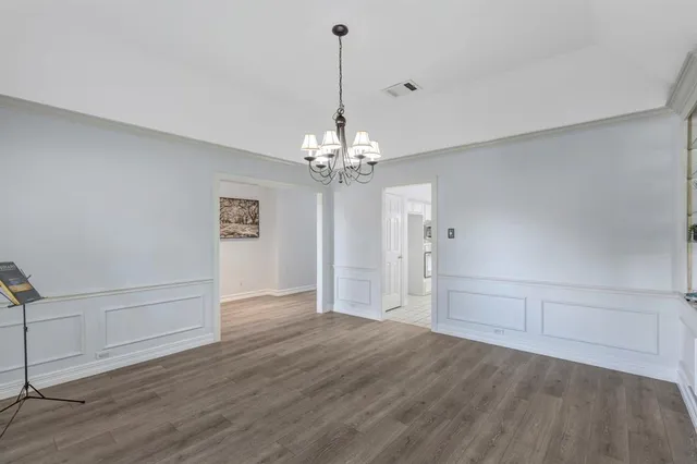 a view of a chandelier in an empty room