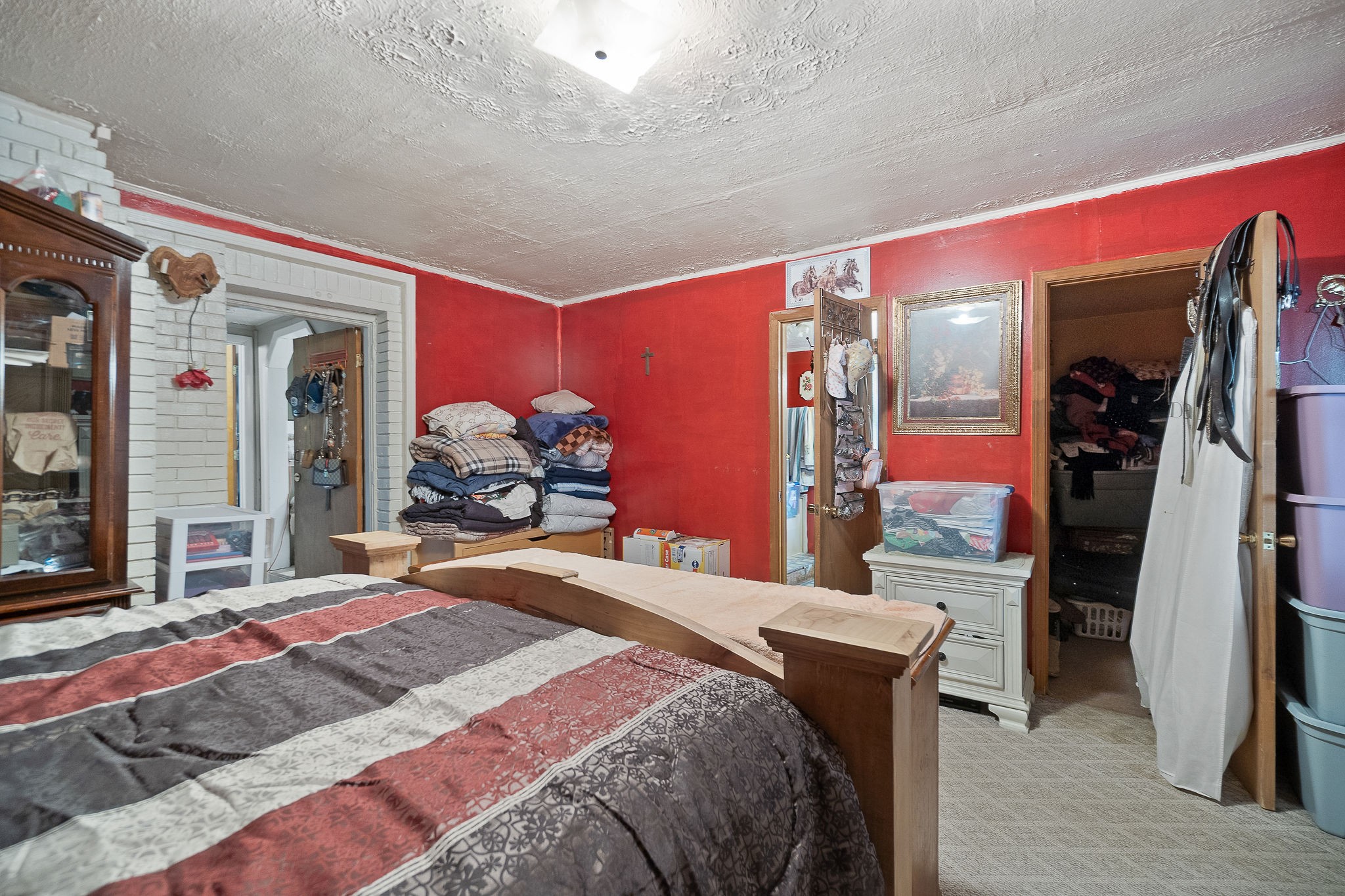 2184 Hyder Mountain Road Cookeville, TN 38506 - Photo 13 of 33 a bedroom with a bed dresser and a large mirror